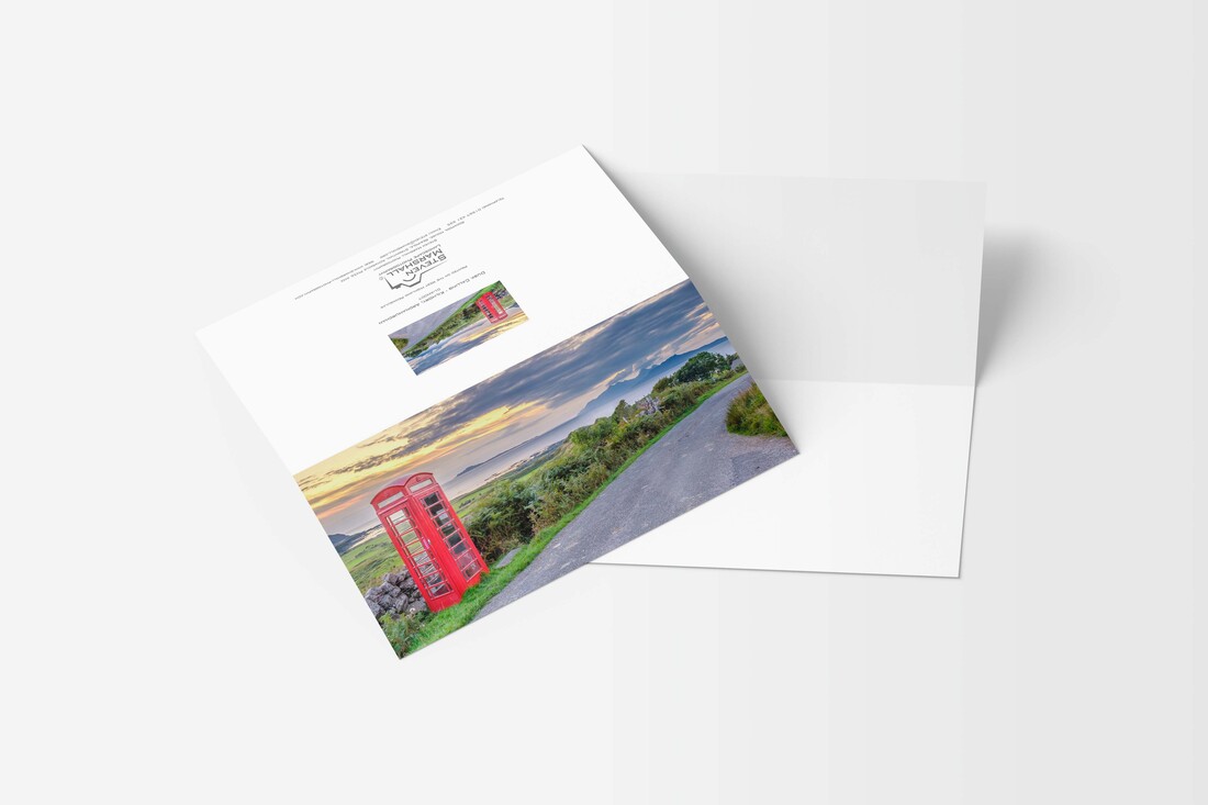 A DL sized greeting card featuring a freshly painted Kilmory phone box set against a backdrop of the Small Isles of Muck, Eigg and Rùm at dusk on a late summer evening | Ardnamurchan Scotland