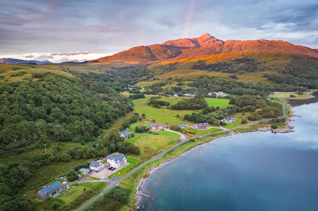 An ariel view of Ben Resipole turned orange by the light of the setting sun| Sunart Scotland | Steven Marshall Photography