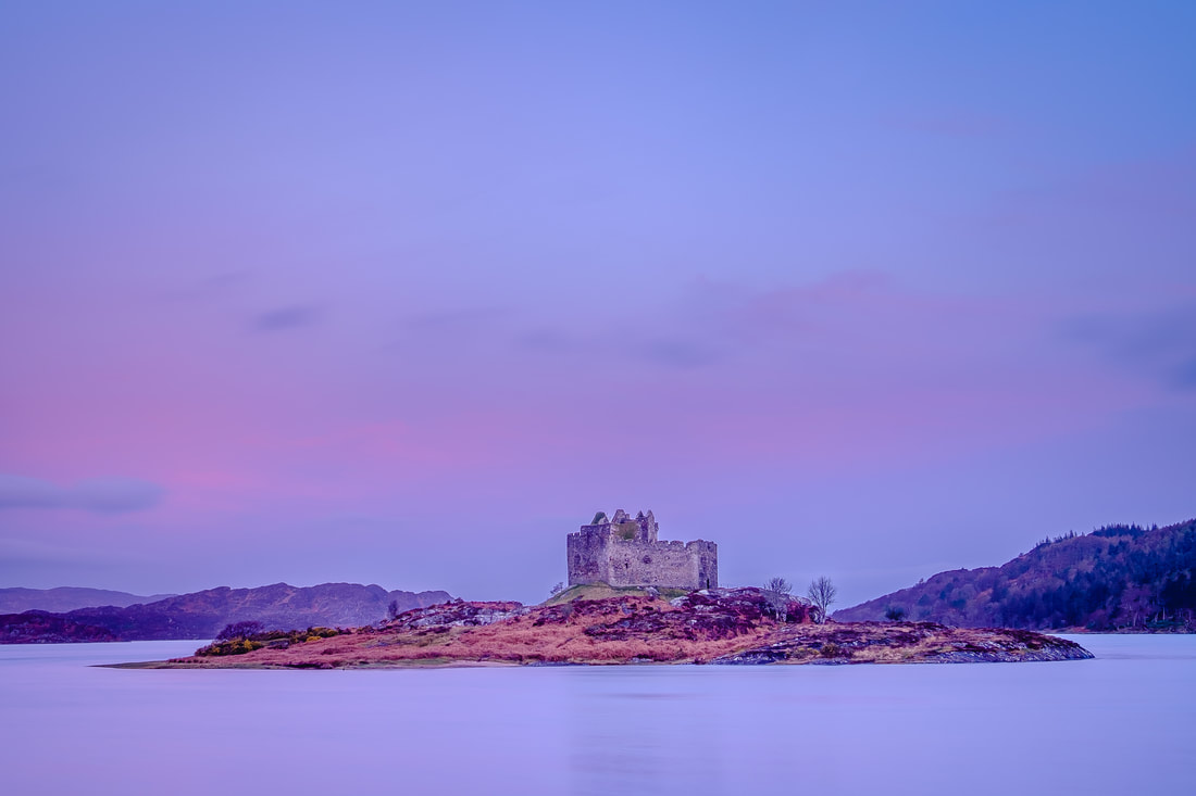 Castle Tioram in the lilacs and pinks of a sunrise as a new day begins | Moidart Scotland