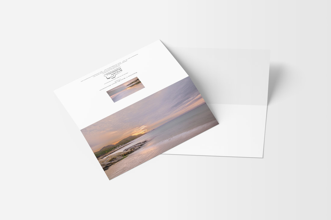 A DL sized greeting card featuring clouds over Sanna Beach with a small gap in them letting through golden light onto the water and sand | Ardnamurchan Scotland