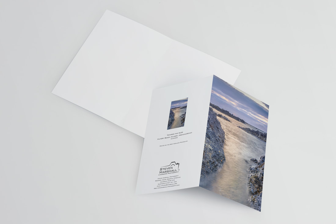 An A6 greeting card featuring waves flowing in and out of a rocky channel leading out towards the Small Isles of Eigg and Rùm with the last of the evening light falling upon it | Ardnamurchan Scotland