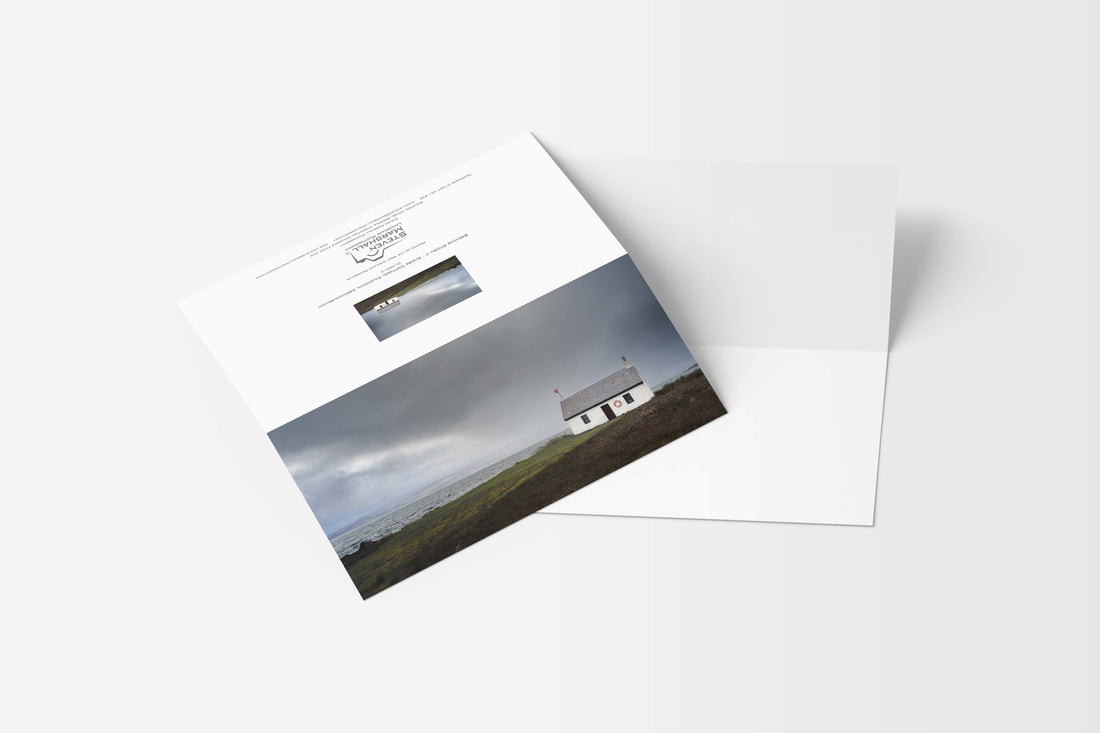 A DL sized greeting card featuring Grey and imposing clouds filling the sky above Shore Cottage as a storm approaches | Ardnamurchan Scotland