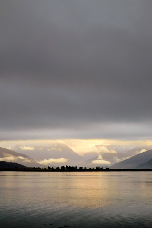 The view across Loch Linnhe of the Mountains of Glencoe beneath a thick blanket of cloud | Ardgour Scotland