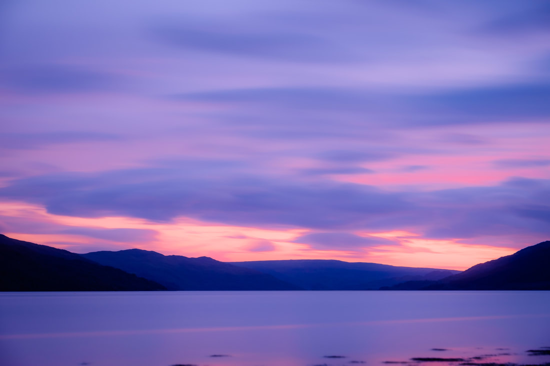Dusk falling on Loch Sunart and the sky filling with a myriad of purple and lilac tones | Sunart Scotland