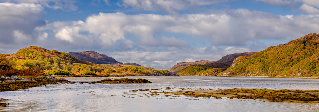 The North Channel of Loch Moidart on an autumn afternoon with the trees on the hills around it showing the autumn colours | Moidart Scotland