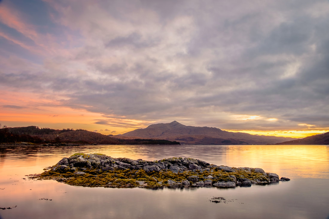 Bay of Flies at sundown showing a calm Loch Sunart after Storm Ophelia hit the UK | Ardnamurchan Scotland