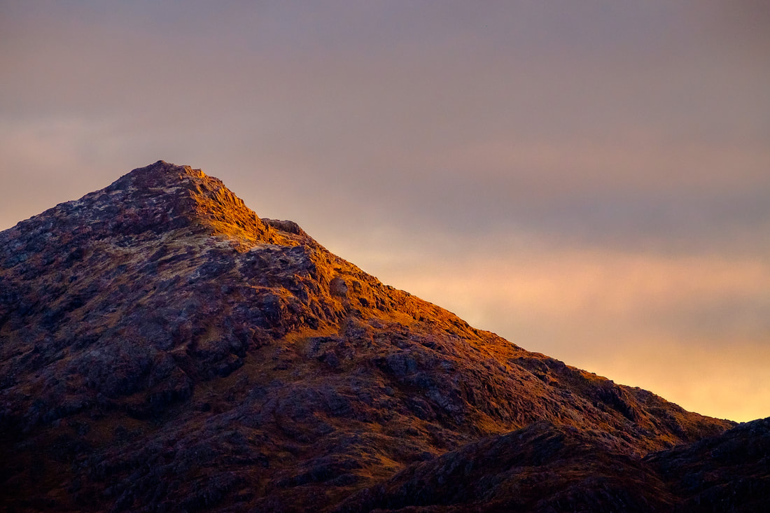 The first light of a mid-November day illuminating the peak of Ben Resipole | Sunart Scotland