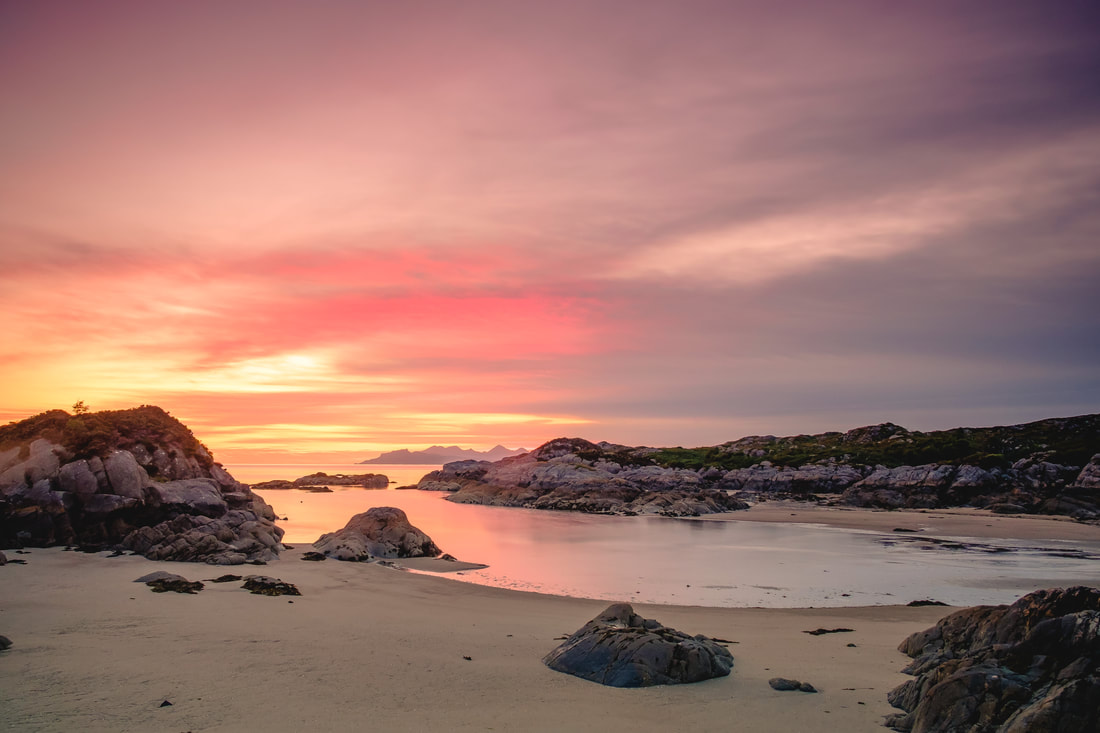 A perfect pink sunset at Ardtoe with the Small Isles of Eigg and Rùm in the background | Ardnamurchan Scotland