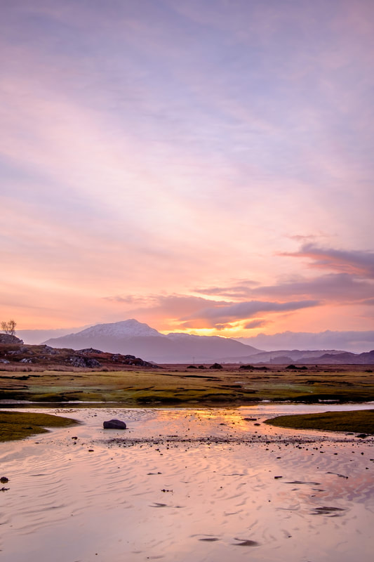 The view at sunrise, looking across Kentra Bay to Ben Resipole with pink and orange colours filling the sky | Ardnamurchan Scotland