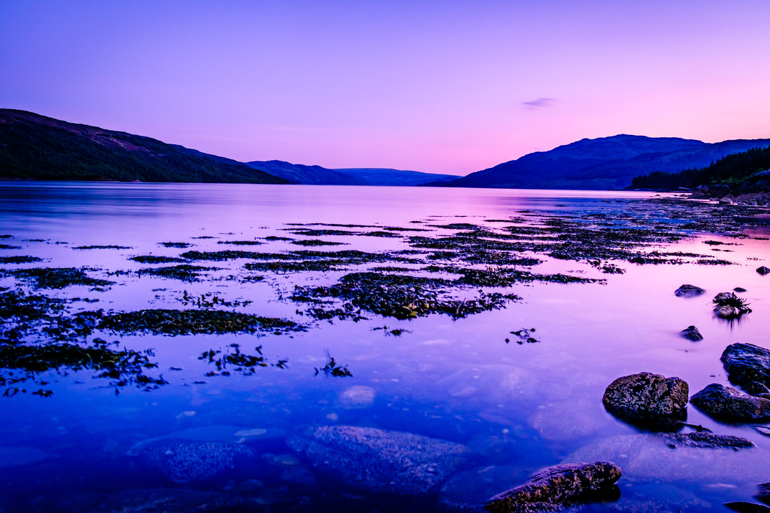 Loch Sunart at sunset with the pink and blue colours of dusk painting both the sky and the water | Sunart Scotland