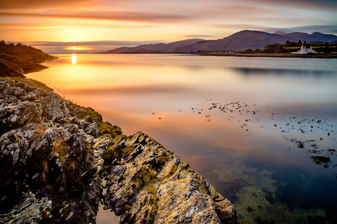 The Corran Narrows at sunset with Corran Lighthouse across and calm Loch Linnhe | Ardgour Scotland