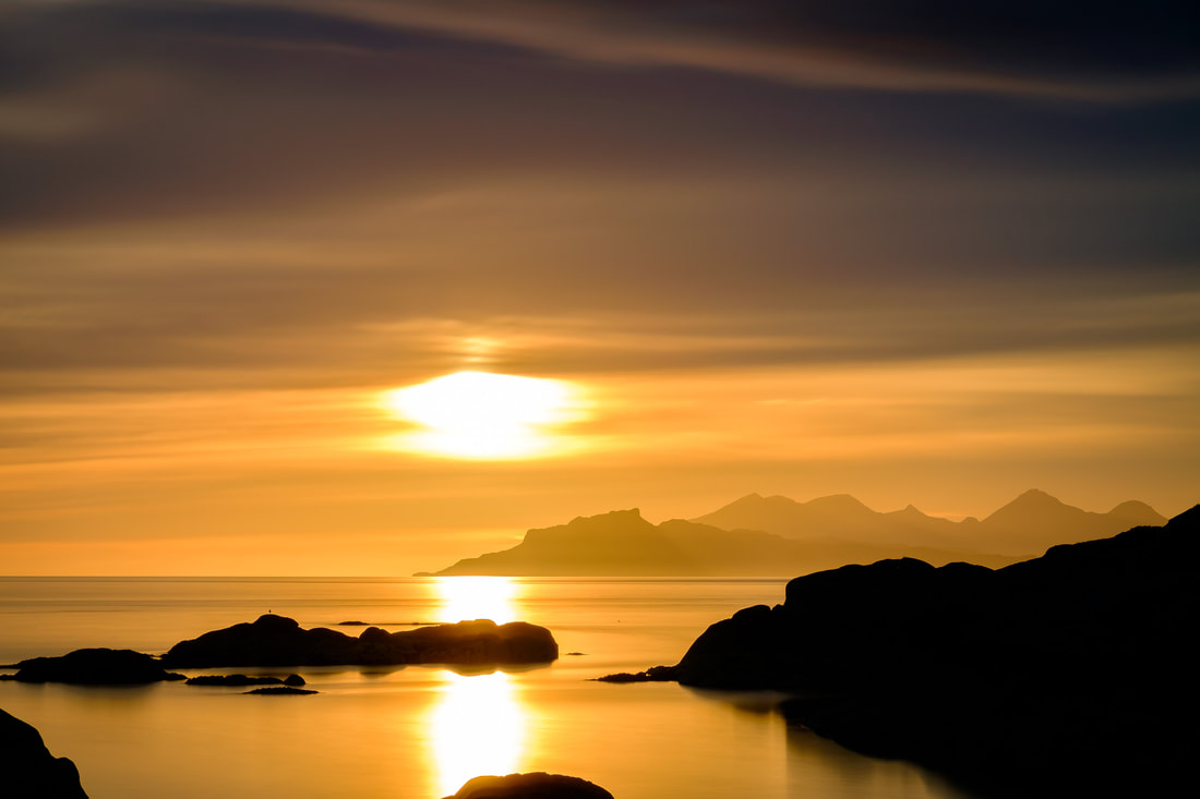 A golden sunset featuring the Small Isles of Eigg and Rùm viewed from Ardtoe | Ardnamurchan Scotland | Steven Marshall Photography