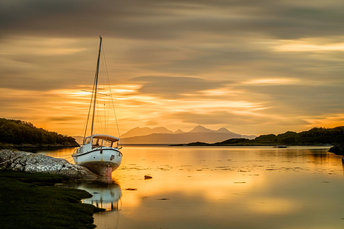 An old sailboat high on the rocks in Samalaman Bay near Glenuig at sunset | Moidart Scotland | Steven Marshall Photography