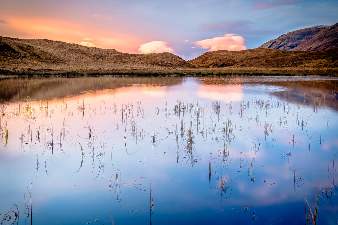 The sun rising in the South-West beyond Lochan Torr an Fhiuch, in the hills between Inversanda and Kilmalieu | Ardgour Scotland