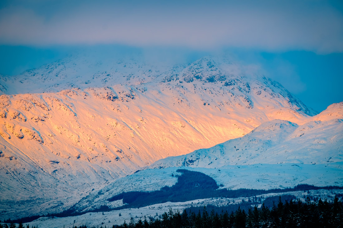 A snow covered Sgurr Dhomhnuill with the last of a winter day’s sunlight on the mountain’s south facing slopes | Ardgour Scotland