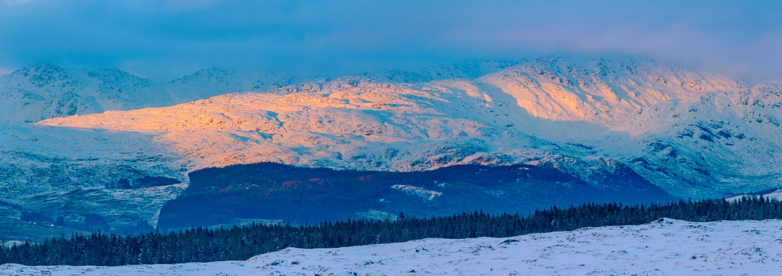 A snow covered Sgurr Dhomhnuill with the last of a winter day’s sunlight on the mountain’s south facing slopes | Ardgour Scotland