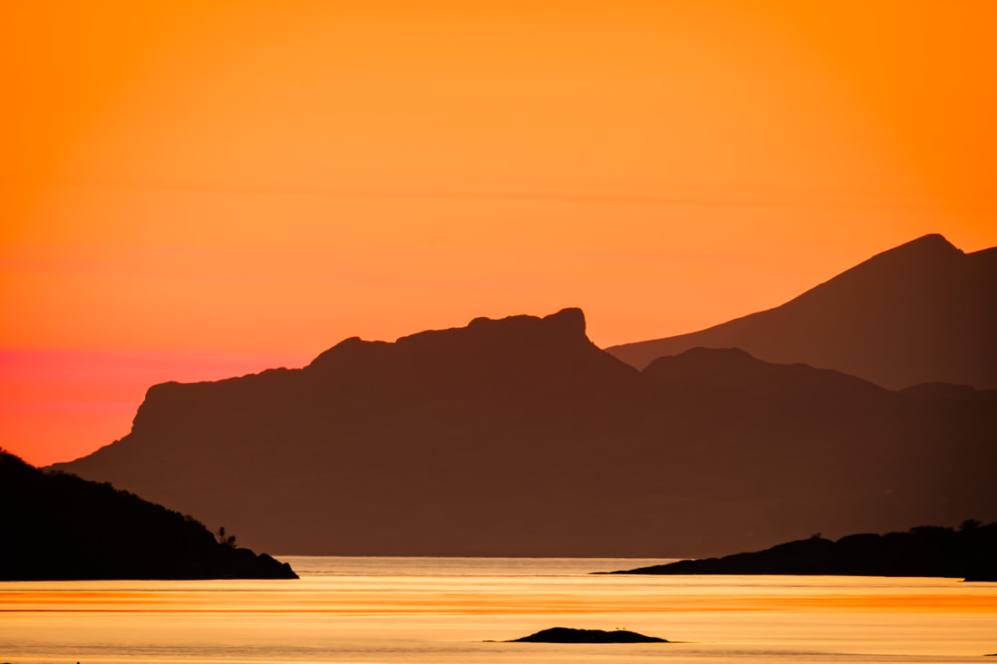 The Isle of Eigg at Sunset viewed through the entrance to Kentra Bay, Ardnamurchan | Steven Marshall Photography