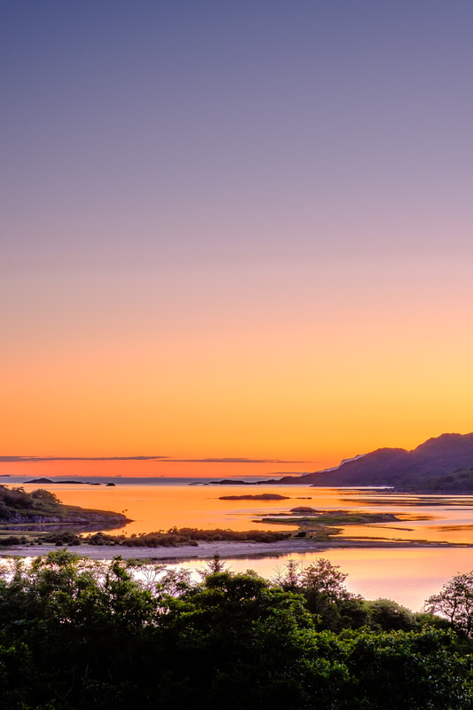 Intense midsummer sunset with the view of the South Channel of Loch Moidart from Dorlin | Moidart Scotland
