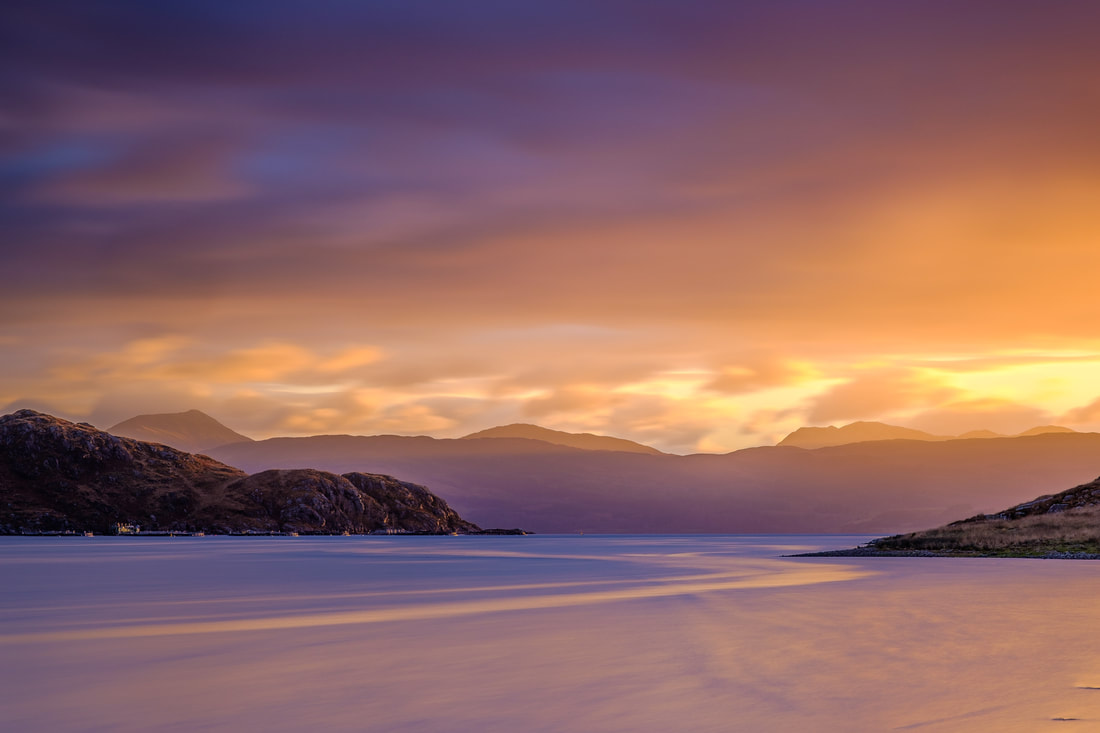 A winter sunrise at Kingairloch, painting the surface of Loch a’ Choire and the sky above with pinks and lilacs | Ardgour Scotland