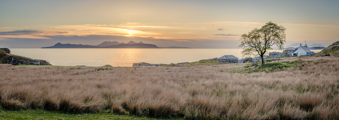 Smirisary crofting settlement nestled among rushes with the Small Isles on the Horizon | Moidart Scotland | Steven Marshall Photography