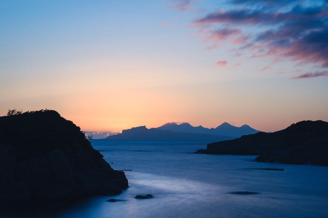 The silhouette of the Isle of Eigg viewed from Ardtoe during the blue hour | Ardnamurchan Scotland | Steven Marshall Photography
