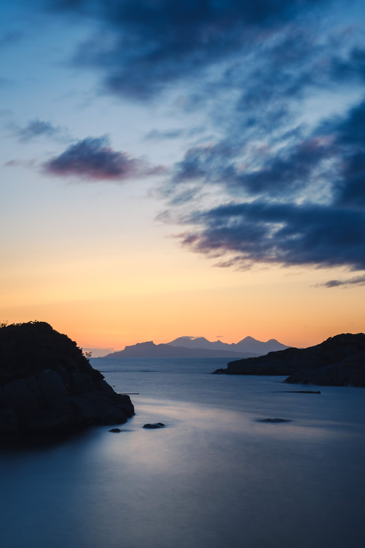 The silhouette of the Isle of Eigg viewed from Ardtoe during the blue hour | Ardnamurchan Scotland | Steven Marshall Photography