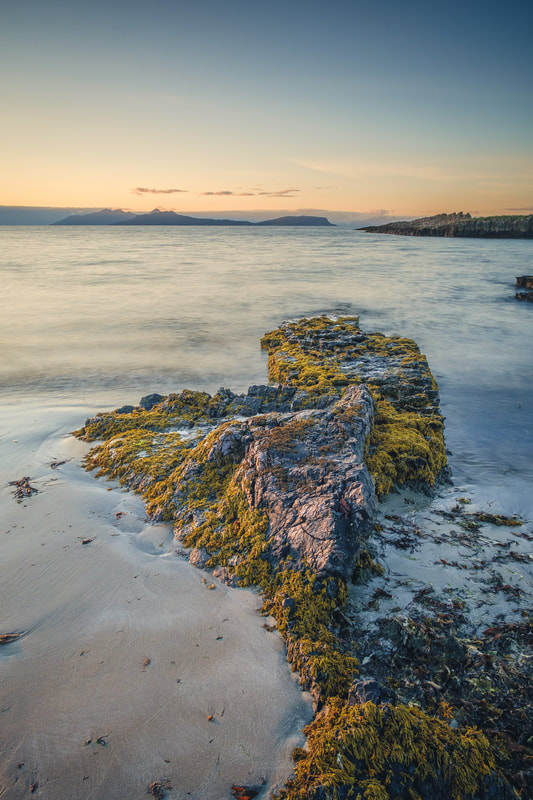 One of the 200-million-year-old limestone rocks are scattered across the shoreline at Swordle Bay | Ardnamurchan Scotland | Steven Marshall Photography