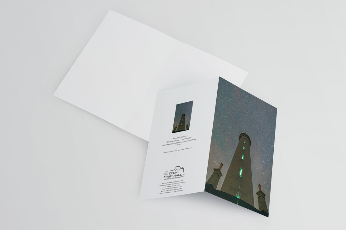 An A6 greeting card featuring the view of Ardnamurchan Lighthouse from its base looking directly up to the light and a starry sky above | Ardnamurchan Scotland