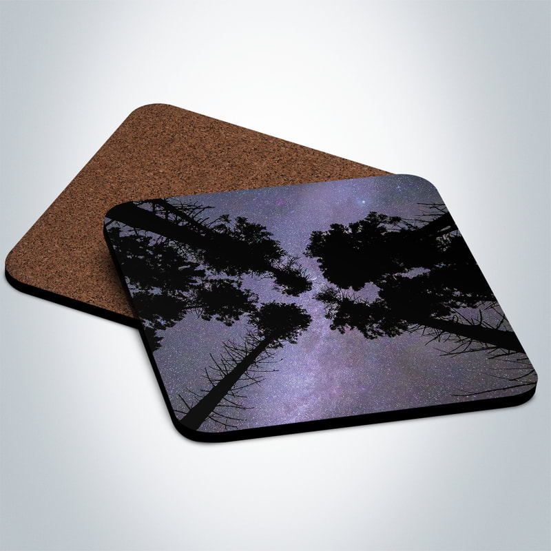 A souvenir photo coaster featuring an image taken looking upwards at a starry sky through a canopy of trees at Sailean nan Cuileag, Salen, Ardnamurchan. An ideal gift from Ardnamurchan on the West Highland Peninsulas, Scotland.