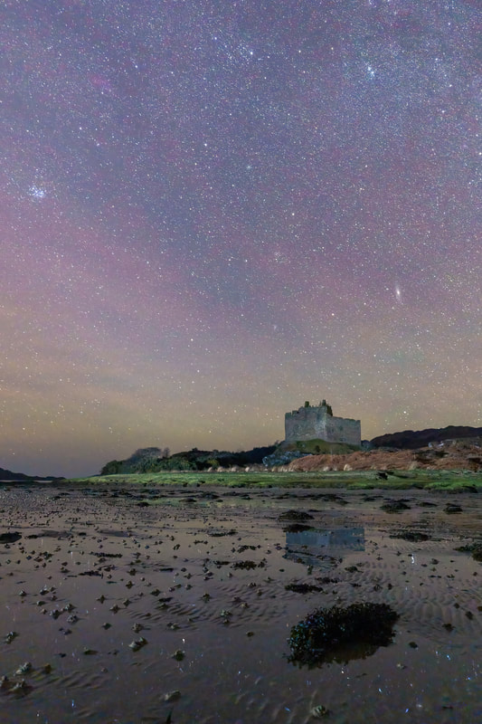Stars reflected in the pools of water left in the sand by the receding tide at Castle Tioram, Moidart, Scotland | Steven Marshall Photography