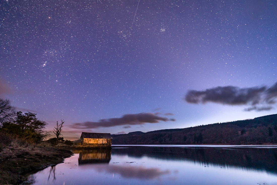 The stars emerging above the old boathouse at Ardtornish Estate as astronomical twilight stars and darkness falls | Morvern Scotland