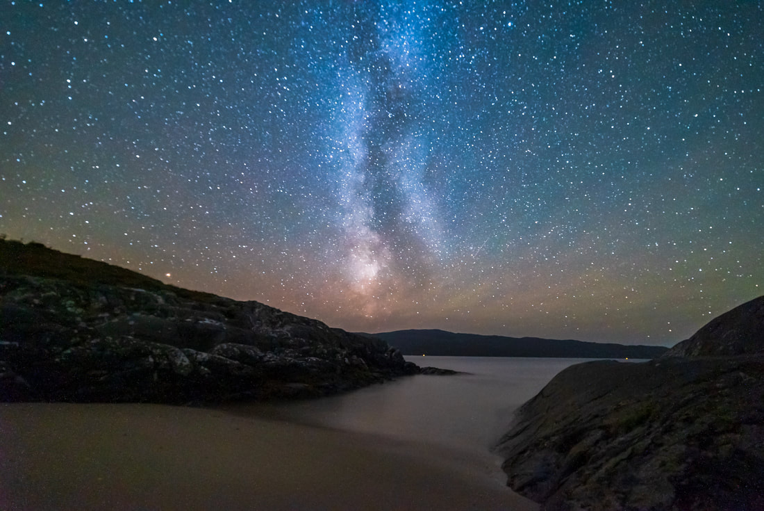 The Milky Way extending above the pink of airglow and the tiny beach at Sailean Dubh near Ardtoe | Ardnamurchan Scotland