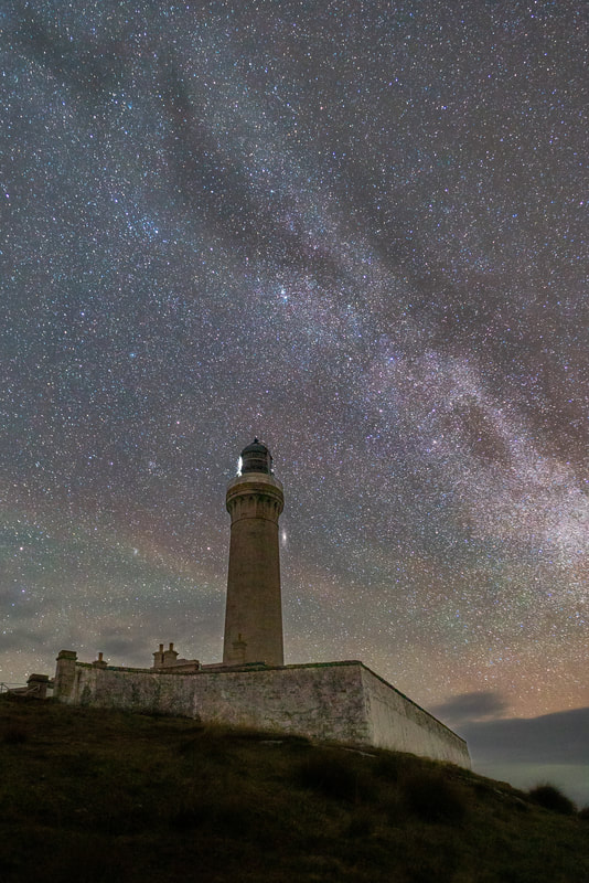 Ardnamurchan Lighthouse sitting under the Milky Way with the Andromeda Galaxy to its right, Ardnamurchan, Scotland | Steven Marshall Photography