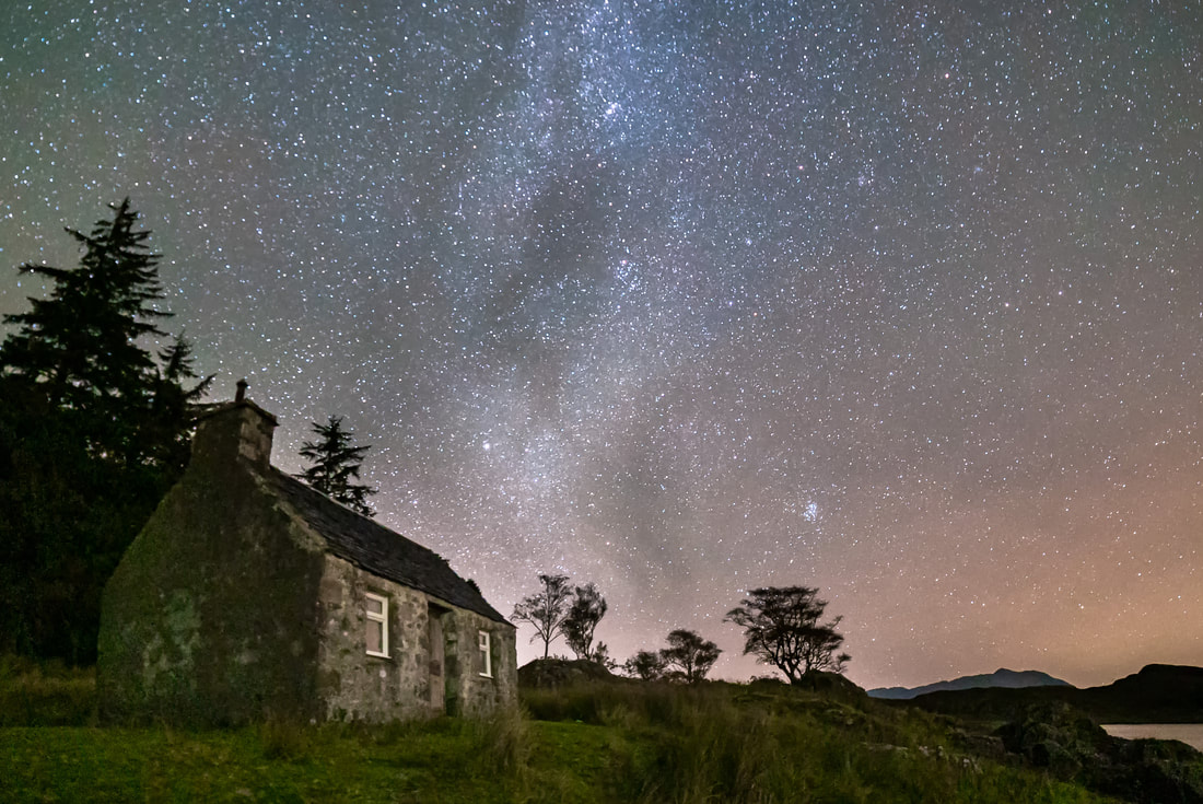 A small bothy by the shore of Loch Linnhe at Kilmalieu under the Milky Way and a night sky full of stars | Ardgour Scotland | Steven Marshall Photography