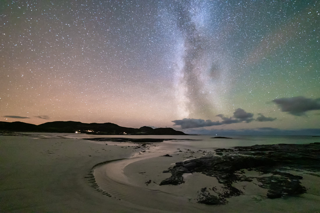 A stream flowing from the sand dunes at Sanna, across the beach and towards the Milky Way and a star-filled sky above it | Ardnamurchan Scotland | Steven Marshall Photography